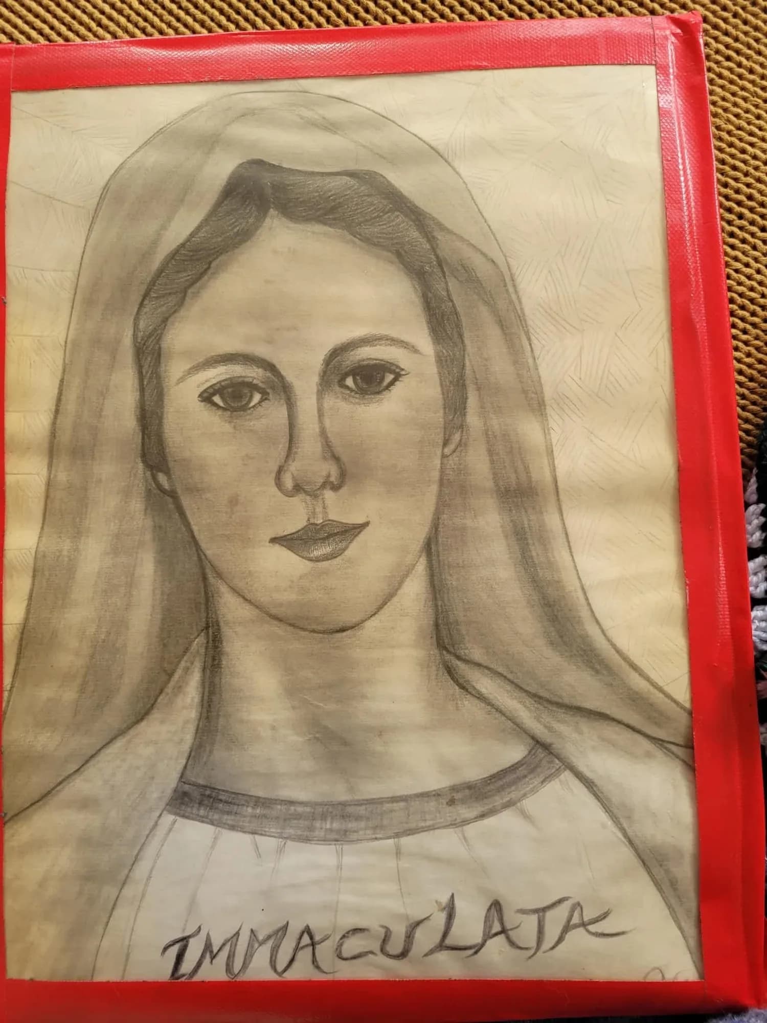 A pencil portrait of the Virgin Mary with a veil, titled Immaculata